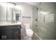 Modern bathroom with dark vanity, sleek fixtures, and a glass-enclosed shower, offering a spa-like experience at 844 Fireside Dr, Greenwood, IN 46143