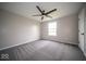 Simple bedroom features a ceiling fan and light-filled window at 844 Fireside Dr, Greenwood, IN 46143