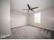 Comfortable bedroom featuring plush carpeting, a ceiling fan, and a bright window, creating a relaxing space at 844 Fireside Dr, Greenwood, IN 46143