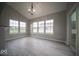 A bright dining area with tile floors, large windows, and sliding glass doors leading to the backyard at 844 Fireside Dr, Greenwood, IN 46143