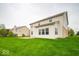 Exterior showcasing a well-maintained yard and rear of home, complemented by ample green space and natural light at 844 Fireside Dr, Greenwood, IN 46143