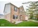 A two-story brick home with a two-car garage, stone accents, and landscaped front yard at 844 Fireside Dr, Greenwood, IN 46143