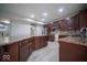 This kitchen features dark wood cabinets, a stainless steel refrigerator, and lots of countertop space at 844 Fireside Dr, Greenwood, IN 46143