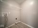 Functional laundry room with utility connections and overhead shelving, offering convenience and organization at 844 Fireside Dr, Greenwood, IN 46143