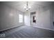 Neutral living room featuring gray carpet, white trim, light gray walls and natural light from one window at 844 Fireside Dr, Greenwood, IN 46143