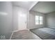 This living room features light gray walls, gray carpet, white trim and a white front door at 844 Fireside Dr, Greenwood, IN 46143