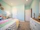 Comfortable bedroom with light blue walls, soft carpet, and bright decor at 8502 Hemingway Dr, Indianapolis, IN 46239