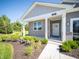 Inviting home exterior features a covered porch, brick accents, and well-maintained landscaping at 8502 Hemingway Dr, Indianapolis, IN 46239