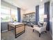 Stylish home office with neutral carpet and large windows with backyard views at 8502 Hemingway Dr, Indianapolis, IN 46239