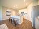 Bright kitchen features a large island with seating, stainless steel appliances, and wood-look flooring at 8502 Hemingway Dr, Indianapolis, IN 46239