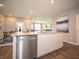 Spacious island kitchen features a stainless steel dishwasher and bar stool seating at 8502 Hemingway Dr, Indianapolis, IN 46239