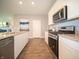 Well-lit kitchen showcases a stainless steel dishwasher, granite countertops, and contemporary finishes at 8502 Hemingway Dr, Indianapolis, IN 46239