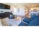 Living area blending seamlessly into the kitchen, featuring stylish furniture and contemporary artwork at 8502 Hemingway Dr, Indianapolis, IN 46239