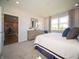 Bright main bedroom with natural light, a dresser, and an open doorway at 8502 Hemingway Dr, Indianapolis, IN 46239