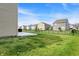 Enjoy this spacious backyard with concrete patio area and black metal fence enclosing the perimeter at 8583 Strabet Dr, Pendleton, IN 46064