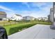 Spacious backyard with well-maintained lawn, a concrete patio, and a wrought iron fence at 8583 Strabet Dr, Pendleton, IN 46064