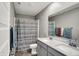 Bathroom featuring double sinks with modern fixtures, a shower with curtain, and clean design at 8583 Strabet Dr, Pendleton, IN 46064