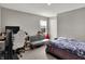Bedroom features a comfortable gray couch, modern desk setup, and plenty of natural light at 8583 Strabet Dr, Pendleton, IN 46064