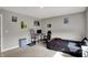 Bedroom featuring a dark bed, plenty of light, and fun decor at 8583 Strabet Dr, Pendleton, IN 46064