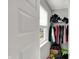 A closet features shelves, hanging storage, and a small window providing light at 8583 Strabet Dr, Pendleton, IN 46064