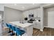 Bright kitchen features a center island with seating, stainless steel appliances, and ample cabinet space at 8583 Strabet Dr, Pendleton, IN 46064