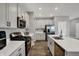 Bright kitchen features a center island, stainless steel appliances, ample counter space, and stylish cabinetry at 8583 Strabet Dr, Pendleton, IN 46064
