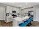 Modern kitchen with stainless steel appliances, white cabinets, and an island with seating at 8583 Strabet Dr, Pendleton, IN 46064