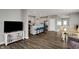 Open-concept living room and kitchen with stainless appliances and a kitchen island at 8583 Strabet Dr, Pendleton, IN 46064