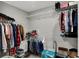 Walk-in closet offers ample storage with hanging racks and shelving for clothes and accessories at 8583 Strabet Dr, Pendleton, IN 46064