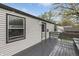 This backyard features a deck and a side view of the home with horizontal siding at 9034 Caminito Ct, Indianapolis, IN 46234