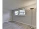 Finished basement area with updated windows, carpeted floors, and natural light at 9034 Caminito Ct, Indianapolis, IN 46234