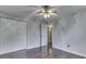 Bedroom with closet, ceiling fan, hardwood floors, and access to the bathroom at 9034 Caminito Ct, Indianapolis, IN 46234
