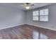 Bright bedroom with hardwood floors, ceiling fan and natural light from the large windows at 9034 Caminito Ct, Indianapolis, IN 46234