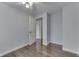 Hardwood floors in bedroom with fan, window, and an adjoining bathroom at 9034 Caminito Ct, Indianapolis, IN 46234