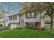 Charming split-level home with attached garage and front yard at 9034 Caminito Ct, Indianapolis, IN 46234