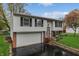 Charming split-level home featuring an attached garage and lovely landscaping at 9034 Caminito Ct, Indianapolis, IN 46234