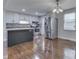 Modern kitchen featuring stainless steel appliances, tiled backsplash, and hardwood floors at 9034 Caminito Ct, Indianapolis, IN 46234