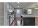 Functional kitchen with an island, sleek countertops, stainless steel appliances, and ample cabinet space at 9034 Caminito Ct, Indianapolis, IN 46234