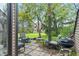 The backyard patio has a grill, several seats, and a view of the spacious green yard at 9658 Highgate N Cir, Indianapolis, IN 46250