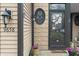 Close up of exterior front door showcasing house number and decorative wreath adding charm and character at 9658 Highgate N Cir, Indianapolis, IN 46250