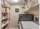 Well-organized laundry room with a washer, dryer, and ample shelving for storage at 9658 Highgate N Cir, Indianapolis, IN 46250