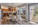 Open-concept kitchen, dining, and living room area with hardwood floors and seamless flow for entertaining at 9658 Highgate N Cir, Indianapolis, IN 46250