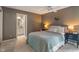 Cozy bedroom with an en-suite bathroom featuring double sinks and granite countertops at 9658 Highgate N Cir, Indianapolis, IN 46250