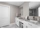 Well lit bathroom with dual vanities and granite countertops at 10239 Wilson Rd, Brownsburg, IN 46112