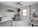 Comfortable Bedroom area with daybed and stylish gray glider at 10239 Wilson Rd, Brownsburg, IN 46112