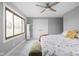 Bright bedroom with ceiling fan, closet, and neutral decor at 10239 Wilson Rd, Brownsburg, IN 46112