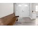 Charming entryway with beautiful wood bench and double front doors at 10239 Wilson Rd, Brownsburg, IN 46112
