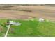 Aerial view of a well-maintained home with a large green lawn, garage, and barn on a spacious lot at 10239 Wilson Rd, Brownsburg, IN 46112