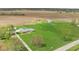 Aerial view of a charming ranch home with a large green lawn, garage, and barn on a spacious lot at 10239 Wilson Rd, Brownsburg, IN 46112