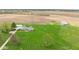 Aerial view of a well-kept home with a large manicured lawn, garage, and barn on a spacious lot at 10239 Wilson Rd, Brownsburg, IN 46112